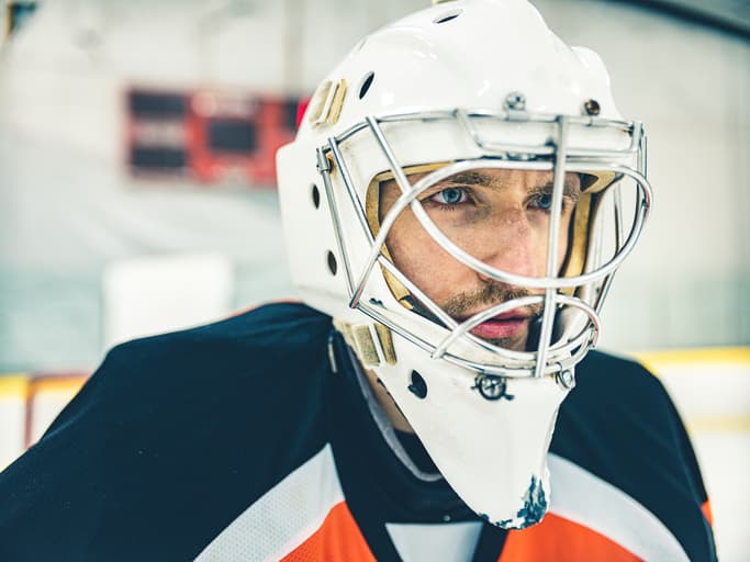 Scorado profile picture of  an Ice Hockey goal keeper looking across  an ice rink.