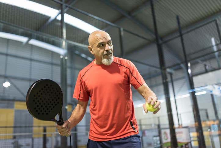 A Scorado Profile picture of a amateur Table Tennis coach preparing to make a serve.